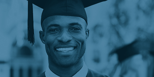 Happy graduate. Happy African man in graduation gowns holding diploma and smiling while his friends standing in the background 